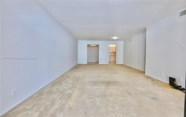 kitchen featuring decorative light fixtures, white cabinetry, white appliances, and light tile patterned floors