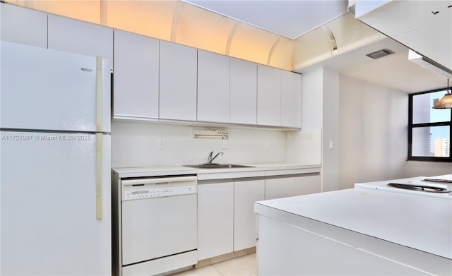 kitchen featuring white cabinetry, sink, white appliances, and hanging light fixtures