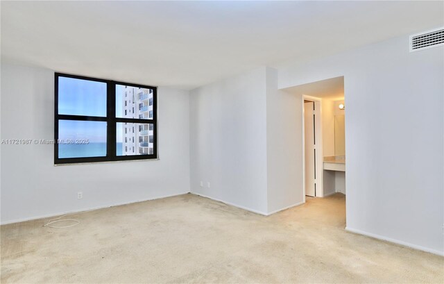 corridor with light colored carpet