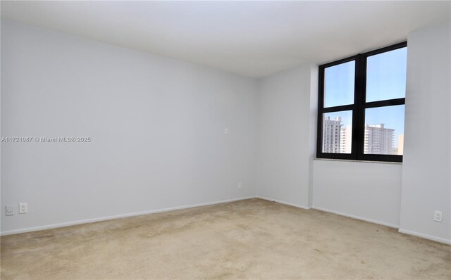 empty room with light colored carpet