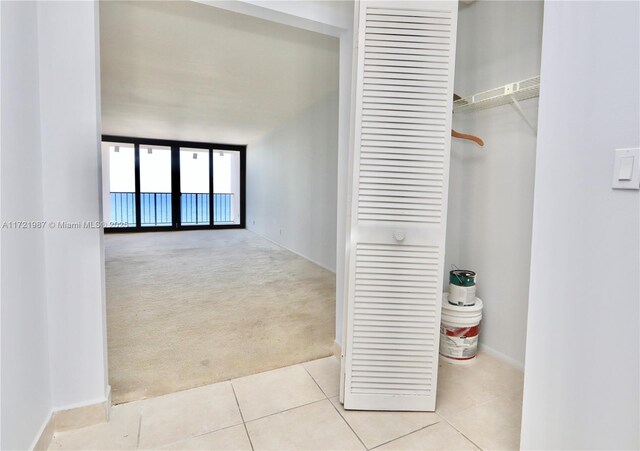 2401 S Ocean Dr Unit 1003, Hollywood, FL 33019 - interior space with tile patterned floors, baseboards, and carpet