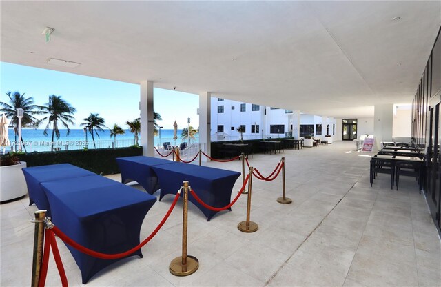 view of patio with a water view