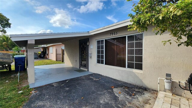 exterior space featuring a carport