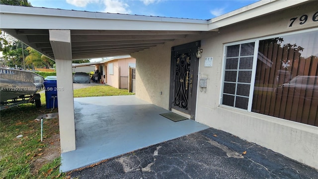 view of patio / terrace with an attached carport