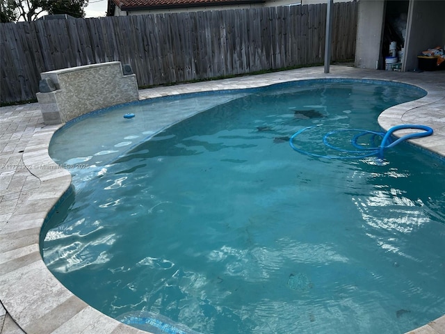 view of pool featuring fence and a fenced in pool