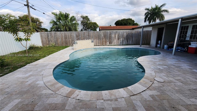 view of pool featuring a patio, french doors, a fenced backyard, and a fenced in pool