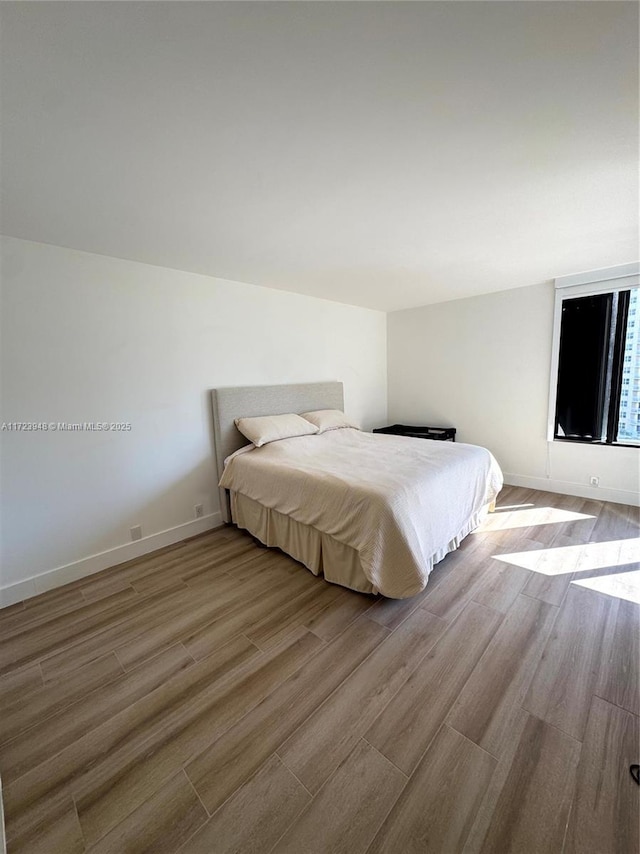 bedroom with light hardwood / wood-style floors