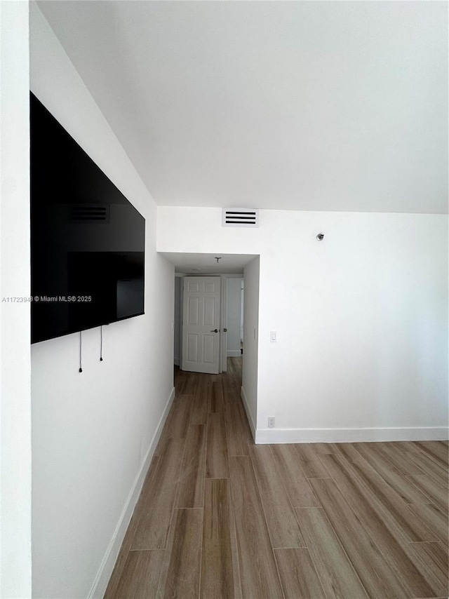 hallway featuring light wood-type flooring