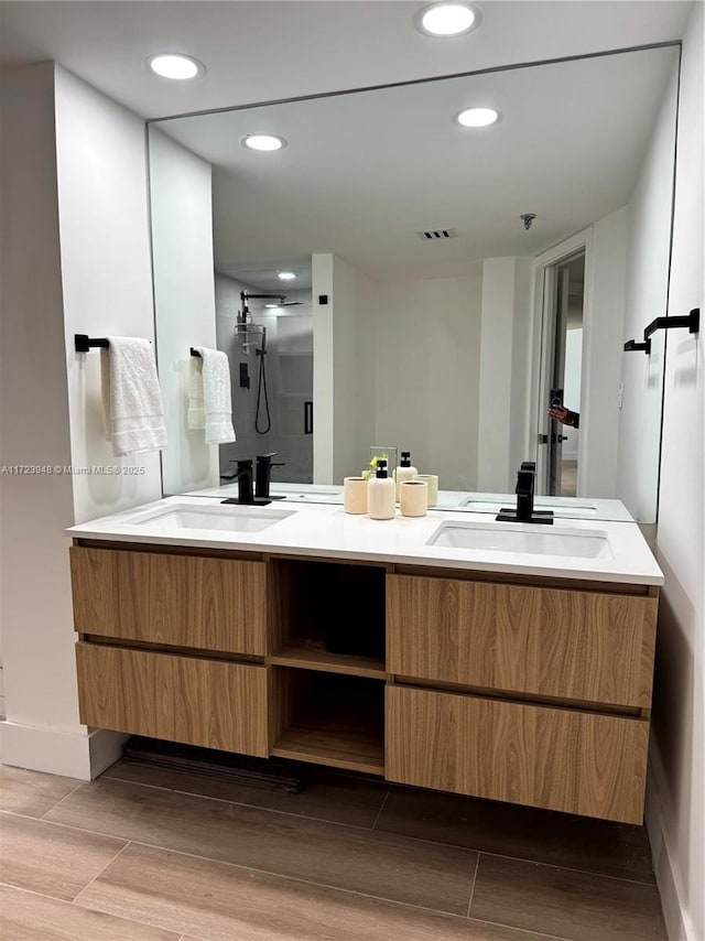 bathroom with vanity and walk in shower