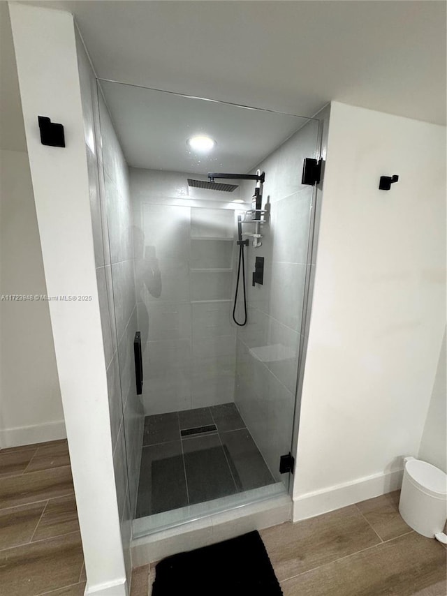 bathroom featuring an enclosed shower