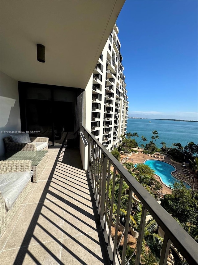 balcony featuring a water view