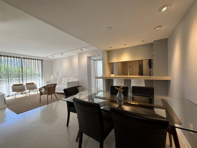 dining area featuring track lighting