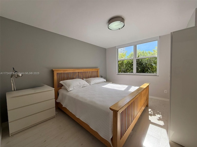 bedroom with light wood-type flooring