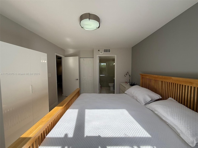 bedroom featuring a closet and ensuite bathroom