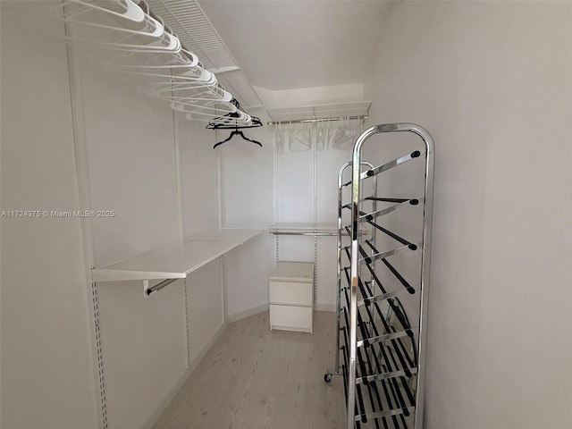 walk in closet featuring light hardwood / wood-style floors