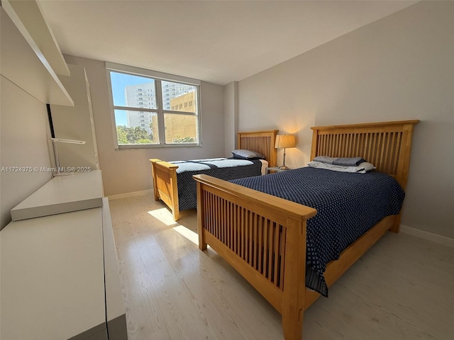 bedroom with light hardwood / wood-style floors