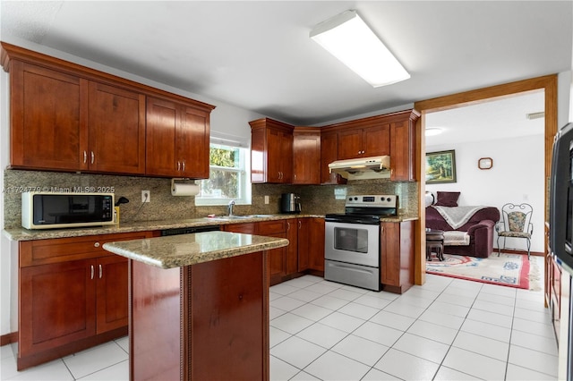 kitchen with stainless steel electric range oven, a kitchen island, light stone countertops, under cabinet range hood, and backsplash