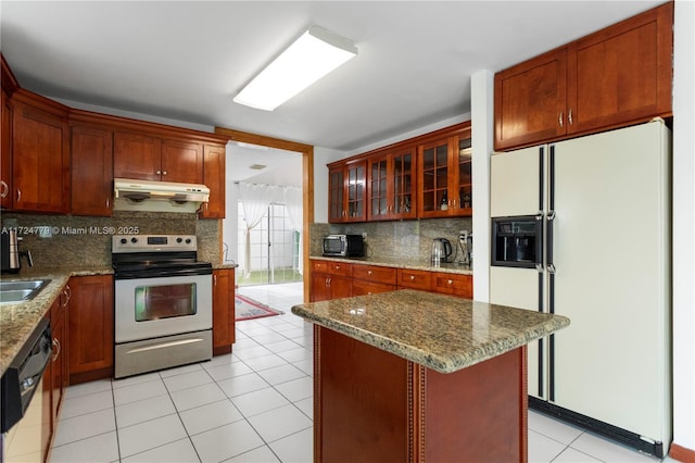 kitchen featuring black dishwasher, tasteful backsplash, under cabinet range hood, stainless steel range with electric stovetop, and white fridge with ice dispenser