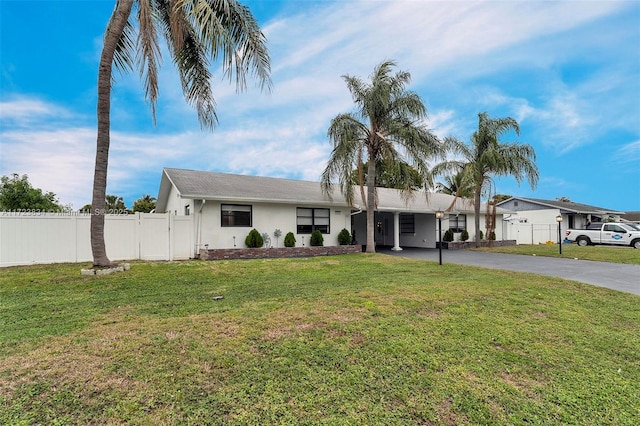 ranch-style home with a front yard