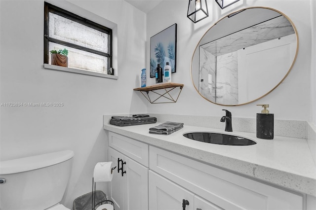 bathroom with vanity and toilet