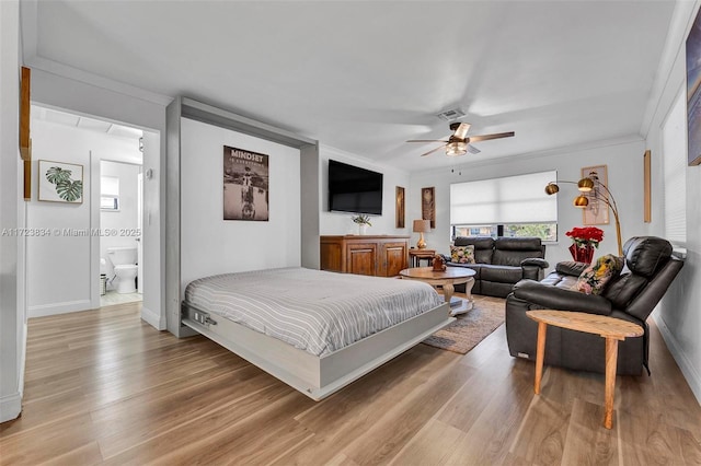 bedroom with ceiling fan, ornamental molding, connected bathroom, and light hardwood / wood-style flooring