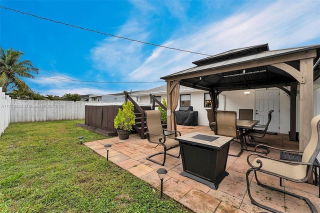 view of patio / terrace featuring a gazebo and an outdoor fire pit