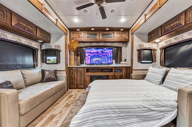 bedroom featuring ceiling fan and light wood-type flooring