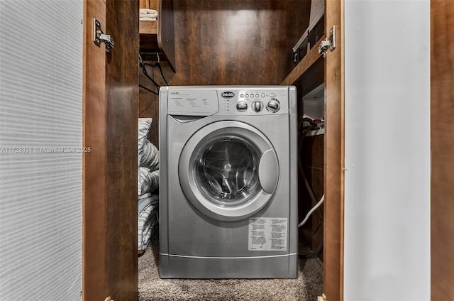 clothes washing area featuring washer / dryer