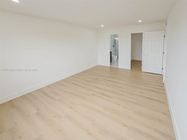 spare room featuring light hardwood / wood-style flooring