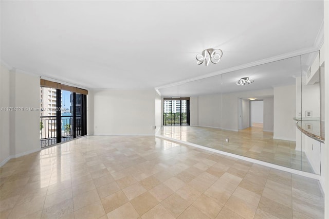 empty room featuring crown molding and a wall of windows