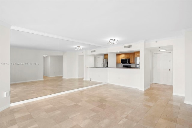 unfurnished living room with ornamental molding