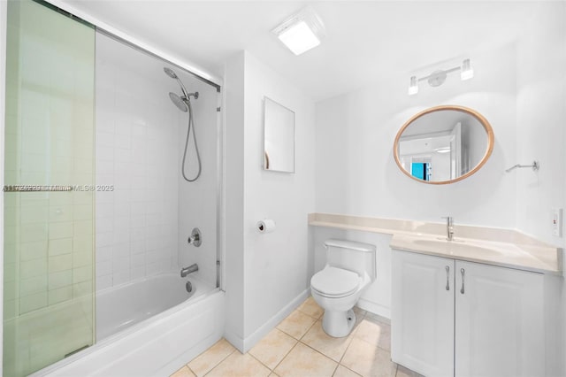 full bathroom with vanity, tiled shower / bath combo, tile patterned floors, and toilet