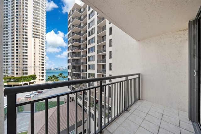 balcony featuring a water view