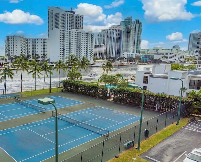 view of sport court featuring a water view