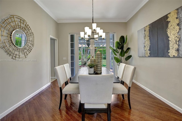 dining room featuring ornamental molding, a notable chandelier, and dark hardwood / wood-style flooring