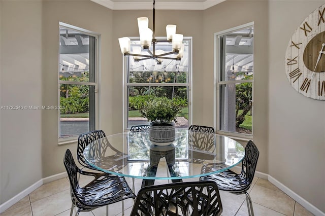 dining room featuring an inviting chandelier, light tile patterned floors, and crown molding