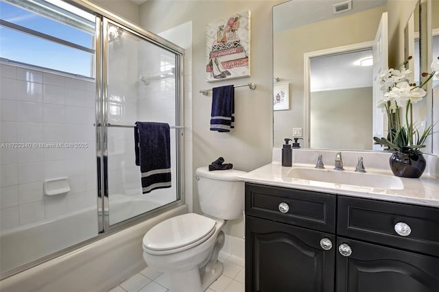 full bathroom featuring enclosed tub / shower combo, tile patterned floors, toilet, and vanity