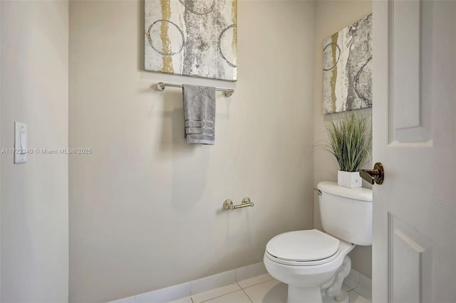 bathroom featuring tile patterned floors and toilet