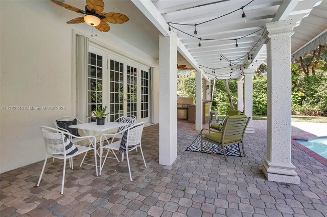 view of patio / terrace with area for grilling, french doors, and ceiling fan