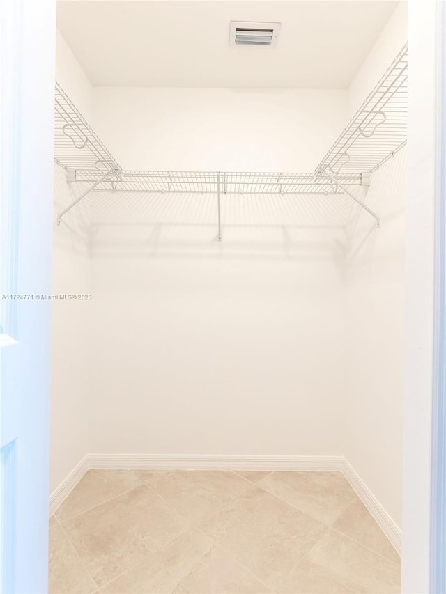 walk in closet featuring tile patterned floors