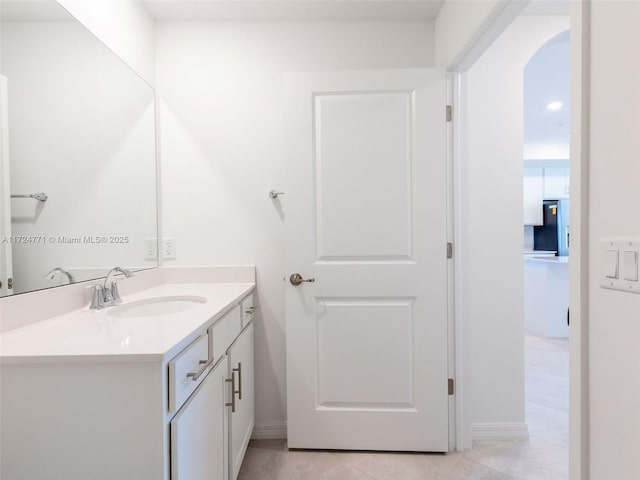 bathroom featuring tile patterned floors and vanity