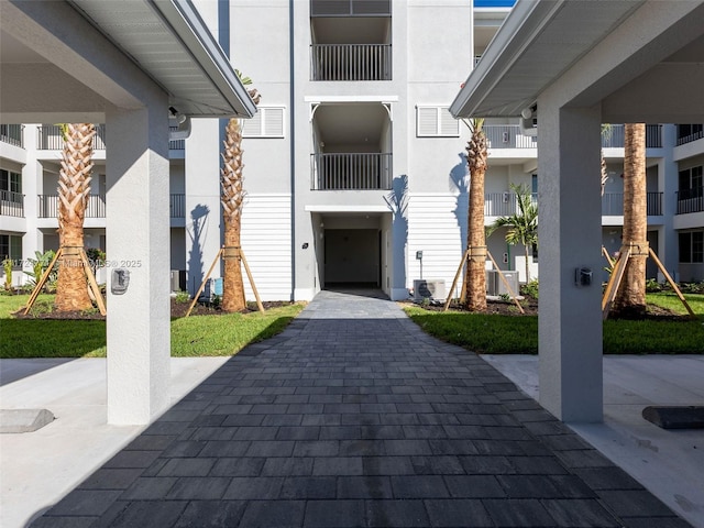 entrance to property featuring cooling unit