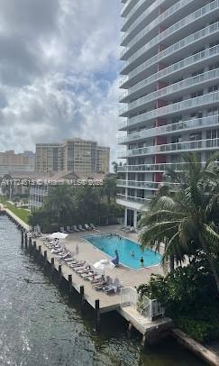 view of pool featuring a water view