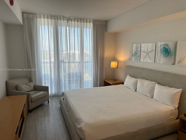 bedroom with wood finished floors