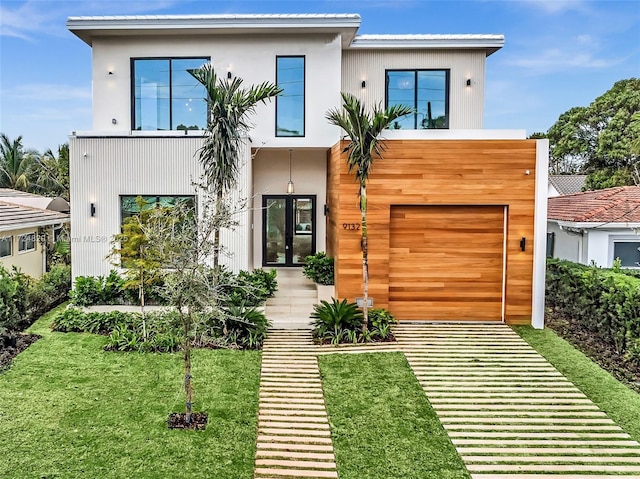 contemporary house with a front lawn and a garage