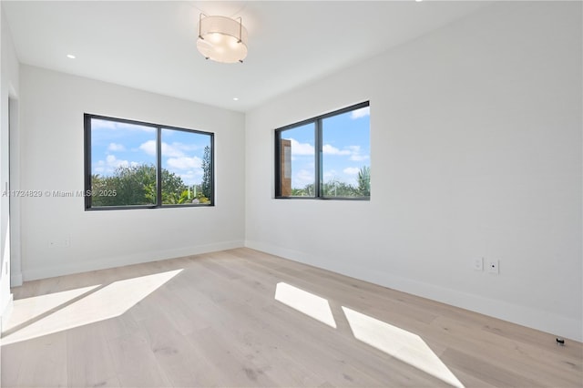 unfurnished room featuring light hardwood / wood-style floors