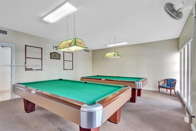 playroom with a textured ceiling, pool table, and light carpet