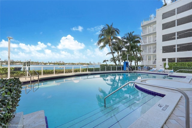 view of pool with a water view