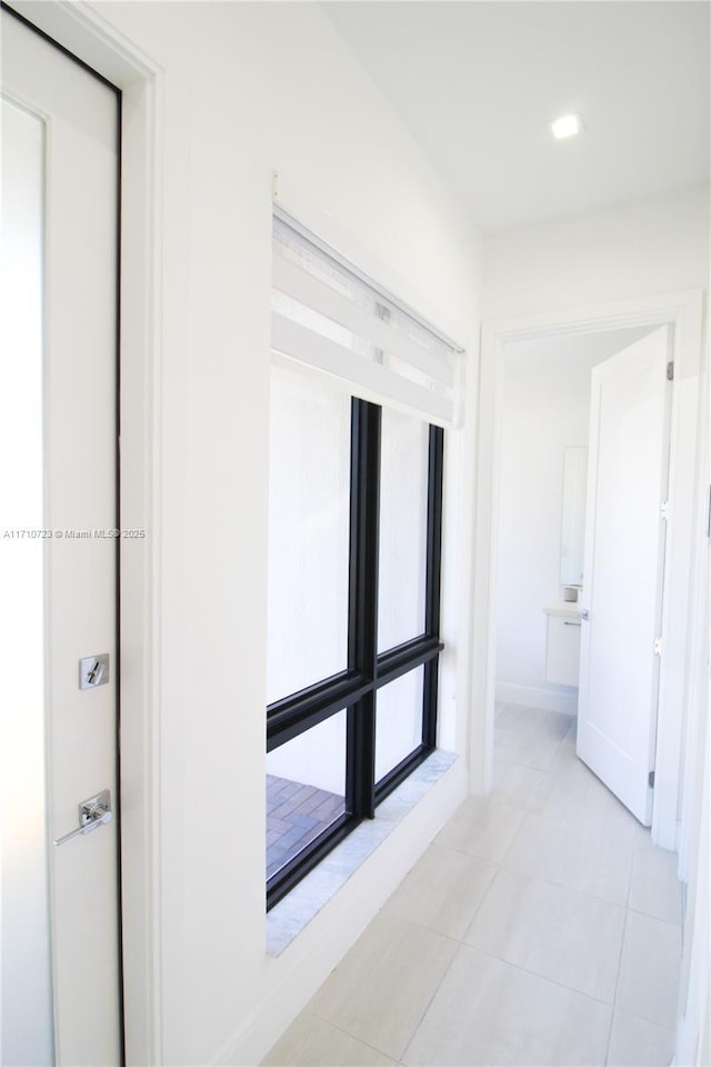 hallway with light tile patterned floors