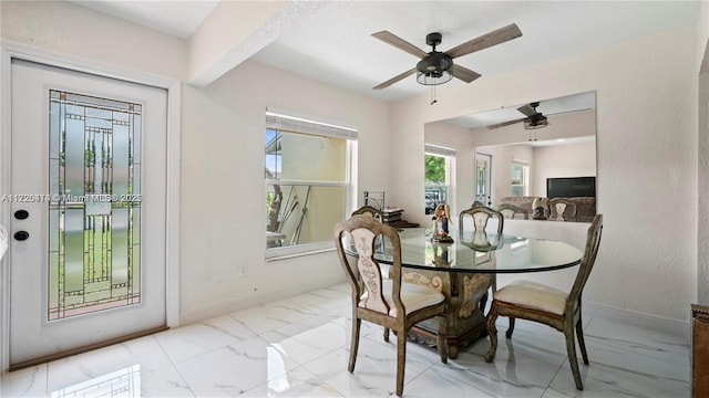 dining space featuring ceiling fan